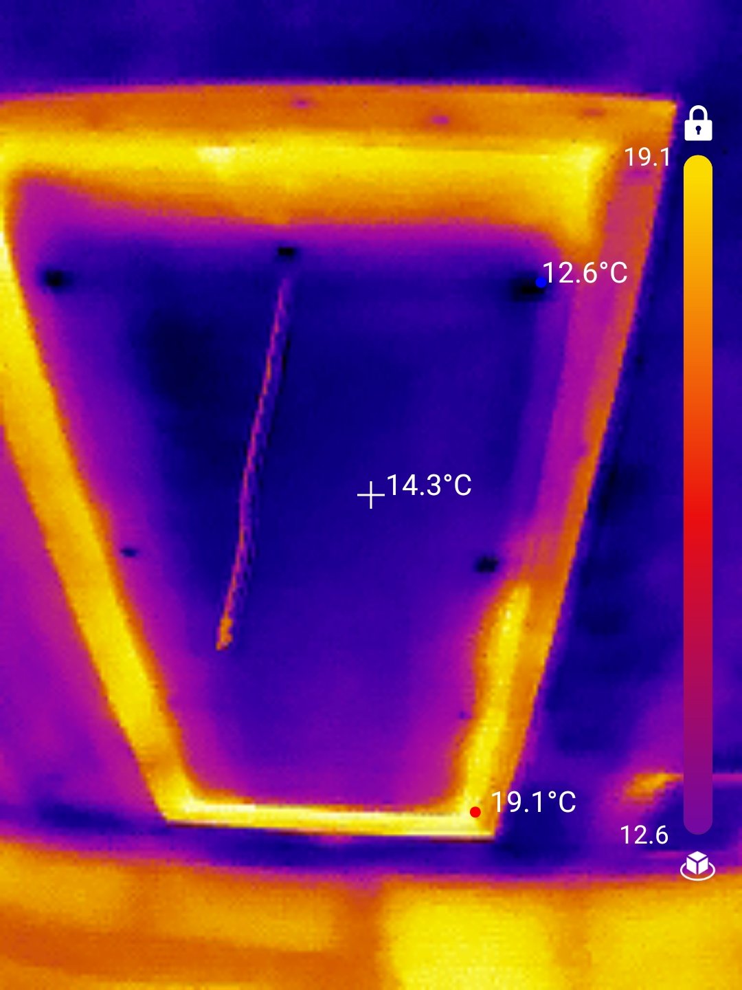 Thermal image of an uninsulated attic hatch losing heat
